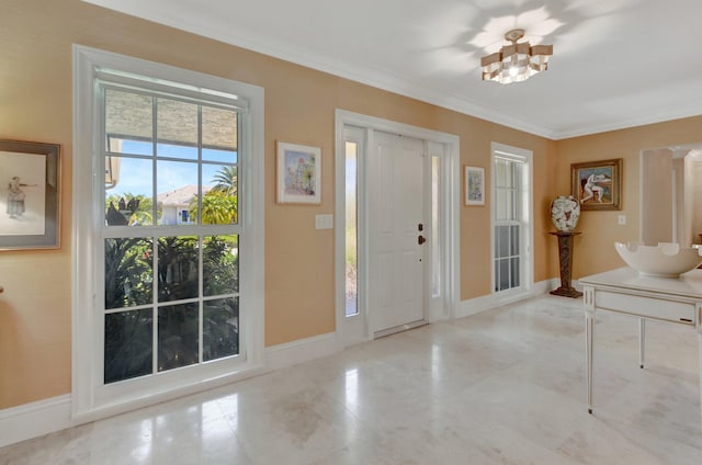 foyer featuring ornamental molding