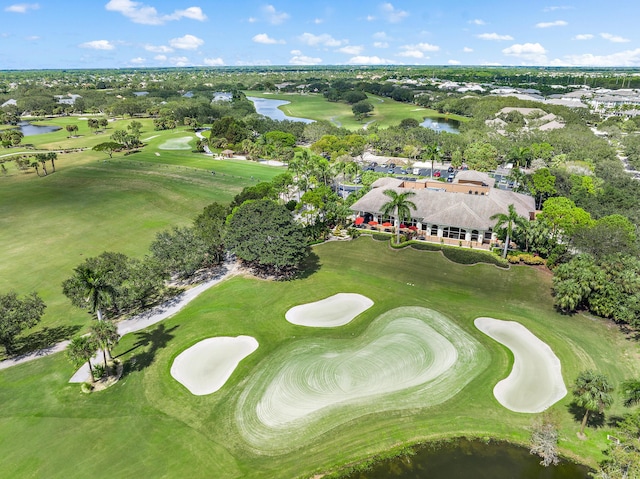 bird's eye view featuring view of golf course and a water view