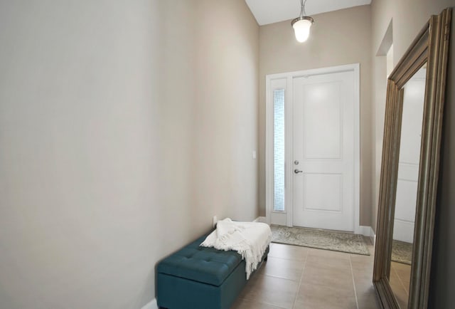 foyer with a healthy amount of sunlight and light tile patterned floors