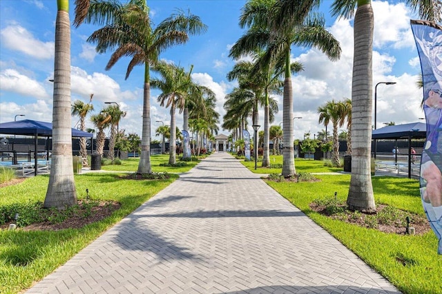 view of property's community with a gazebo and a yard