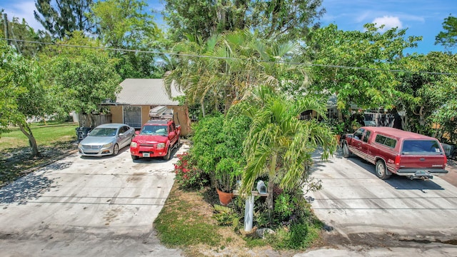 view of property hidden behind natural elements