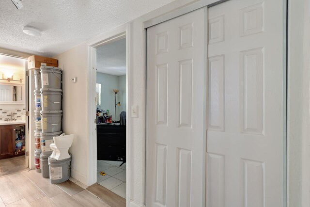 bathroom with toilet, vanity, walk in shower, tile walls, and tasteful backsplash