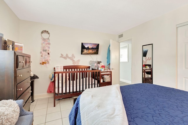 bedroom featuring light tile patterned floors