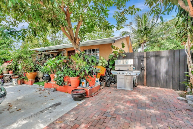 view of patio featuring a grill