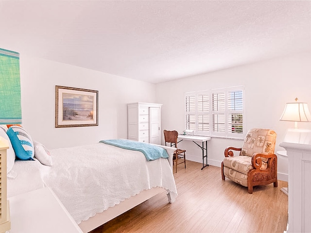 bedroom featuring hardwood / wood-style flooring