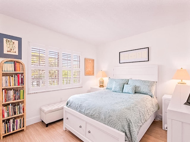 bedroom with light wood-type flooring