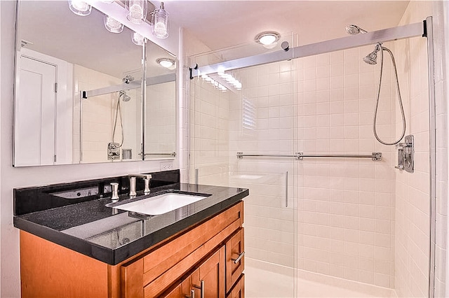 bathroom featuring vanity and walk in shower