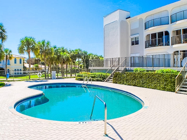 view of pool featuring a patio area