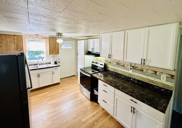 kitchen with light wood-style flooring, electric range, a sink, freestanding refrigerator, and range hood