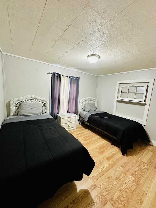 bedroom with light wood finished floors