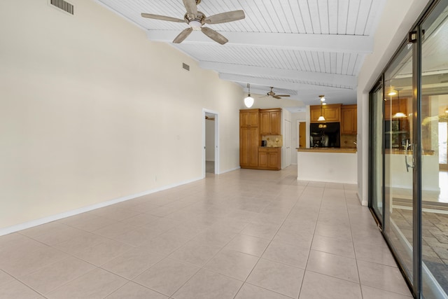 tiled empty room with lofted ceiling with beams and ceiling fan