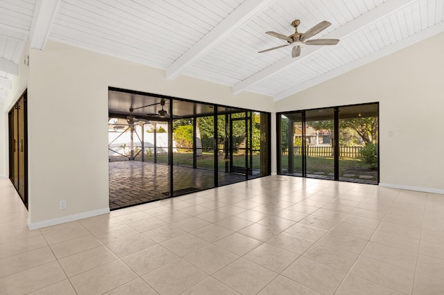 tiled spare room featuring lofted ceiling with beams and ceiling fan