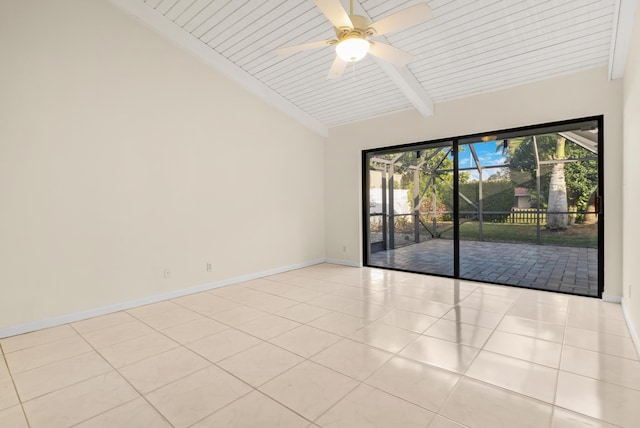 spare room featuring vaulted ceiling with beams, light tile patterned floors, and ceiling fan