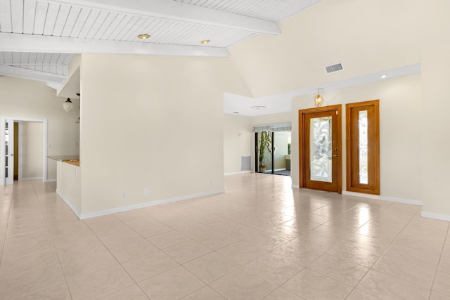 entrance foyer with beamed ceiling, wood ceiling, light tile patterned flooring, and high vaulted ceiling