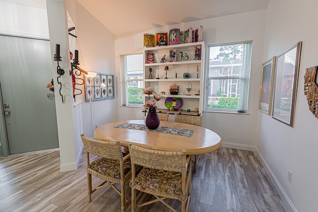 dining space featuring wood-type flooring