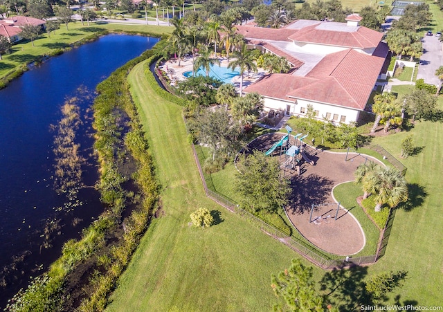 birds eye view of property with a water view