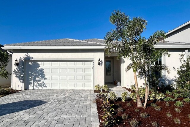 single story home with a garage