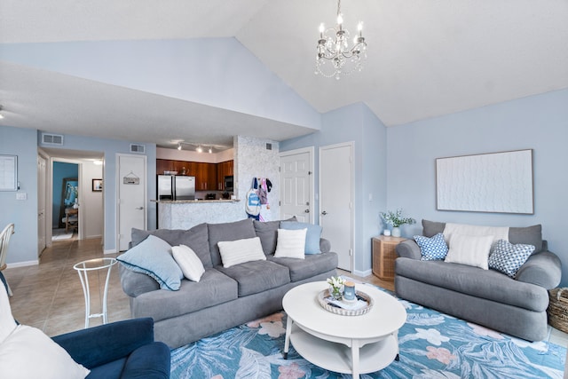 living room featuring vaulted ceiling, an inviting chandelier, and light tile patterned floors