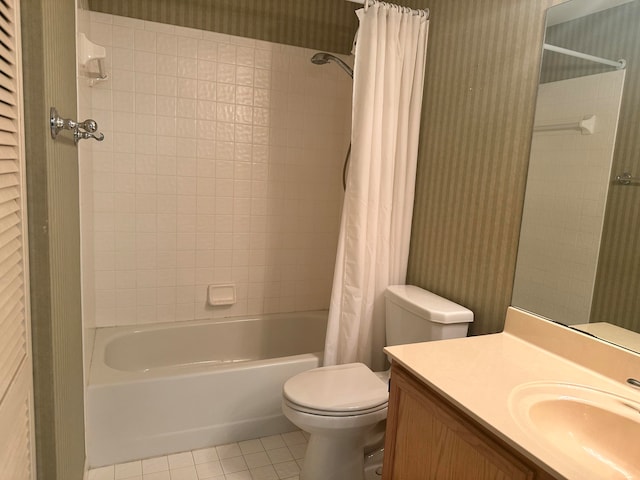 full bathroom featuring vanity, toilet, tile patterned flooring, and shower / tub combo with curtain