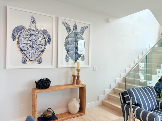 staircase featuring hardwood / wood-style flooring