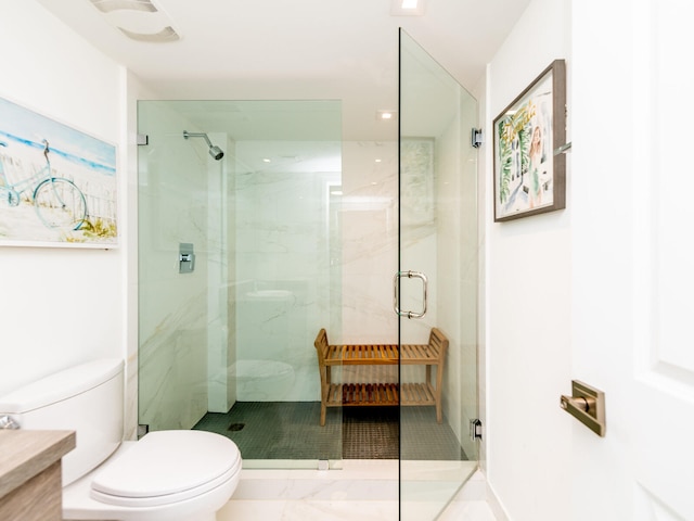 bathroom with walk in shower and toilet