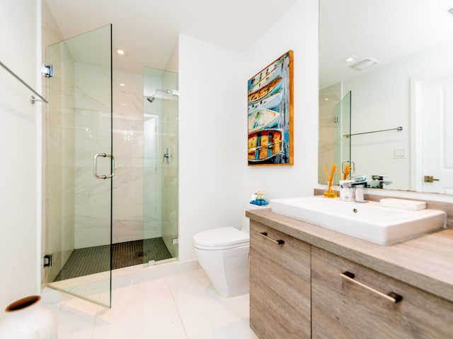 bathroom with walk in shower, toilet, vanity, and tile patterned floors