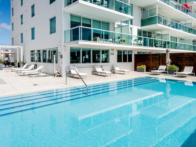 view of pool featuring a patio