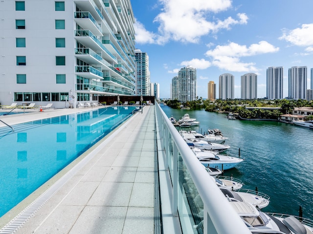 view of pool with a water view