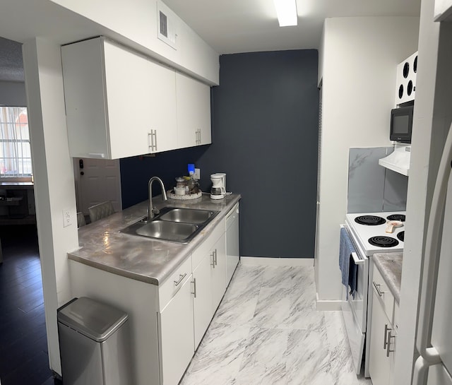 kitchen featuring ventilation hood, sink, white cabinetry, and white appliances