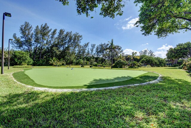 view of property's community featuring a yard