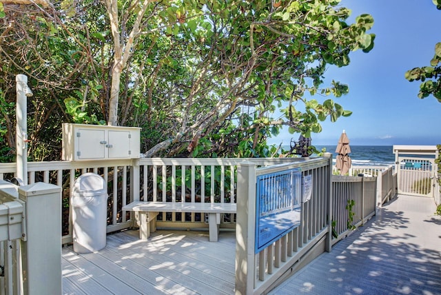 wooden terrace with a water view