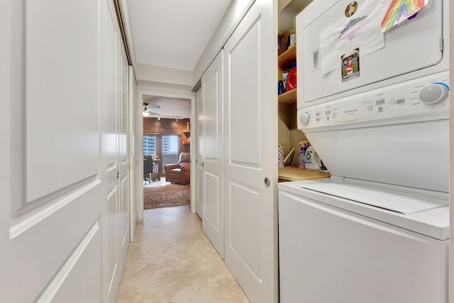 laundry room with stacked washer / drying machine