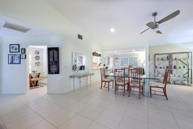 dining area featuring high vaulted ceiling, light tile patterned floors, and ceiling fan