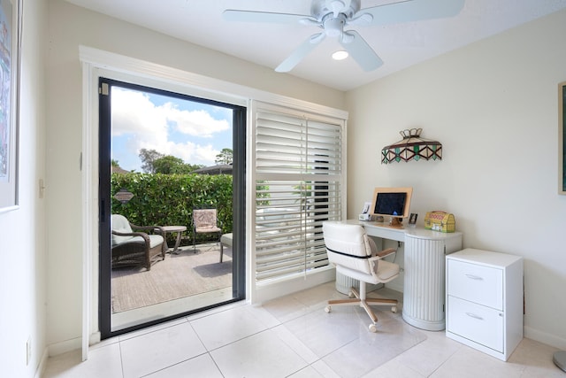 office with ceiling fan and light tile patterned flooring