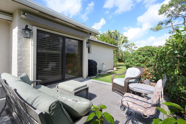 view of patio featuring an outdoor living space and a grill