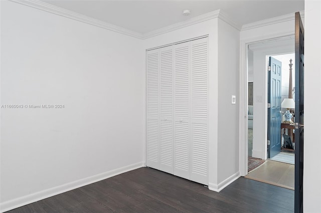 hallway featuring dark wood-type flooring and crown molding