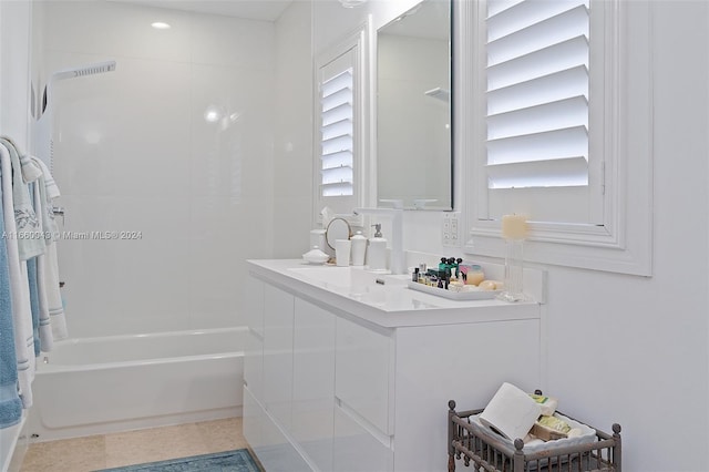 bathroom featuring vanity and tiled shower / bath combo