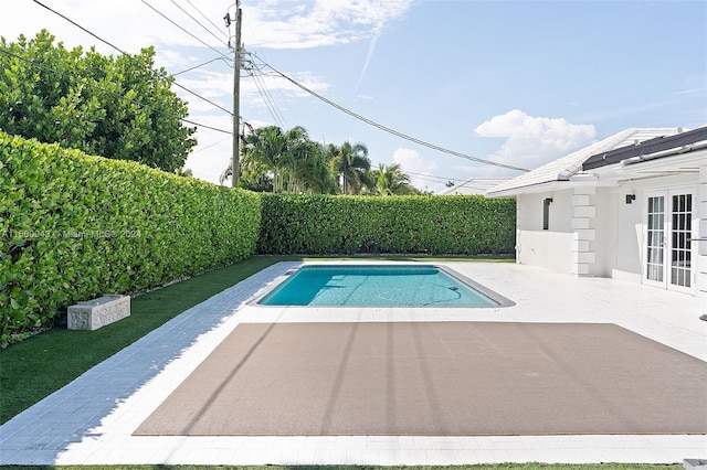 view of swimming pool featuring a patio area