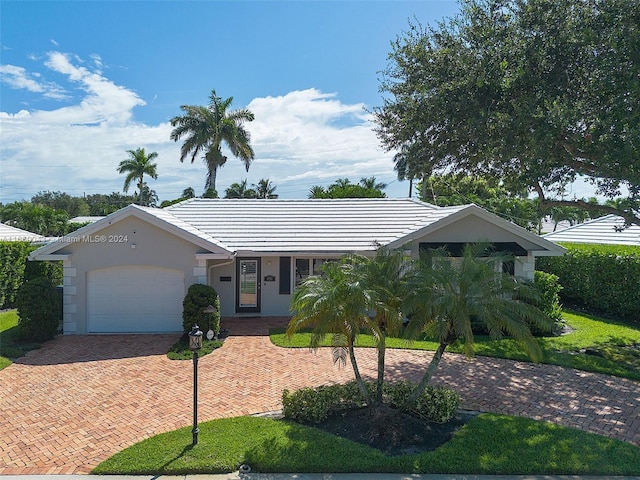 ranch-style house featuring a garage