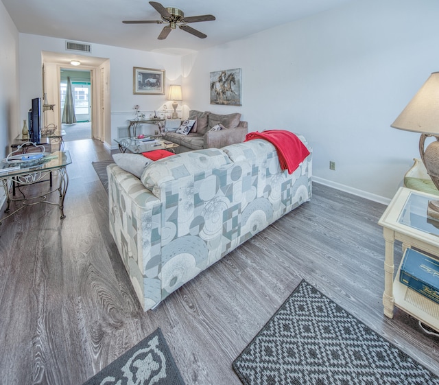 bedroom with dark hardwood / wood-style floors and ceiling fan