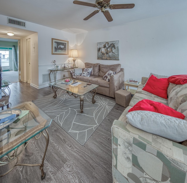 3040 Lake Osborne Dr Unit 106, Lake Worth Beach, FL 33461 - living area featuring a ceiling fan, wood finished floors, and baseboards