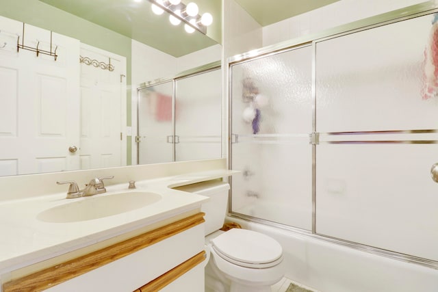 full bathroom with vanity, enclosed tub / shower combo, and toilet