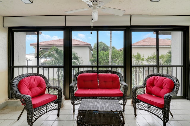 sunroom / solarium featuring ceiling fan