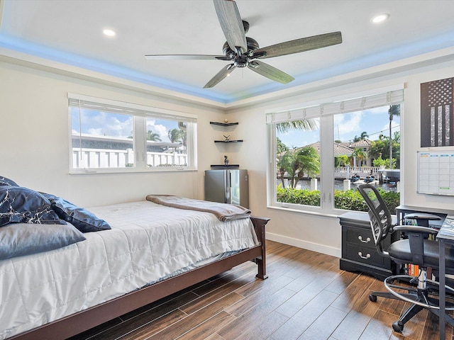 bedroom featuring ceiling fan and dark hardwood / wood-style flooring