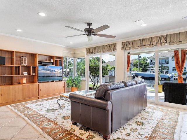 tiled living room with crown molding, a textured ceiling, and ceiling fan