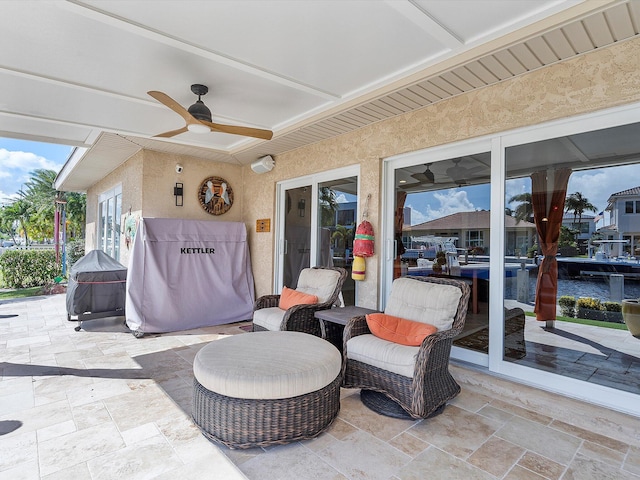 view of patio featuring ceiling fan