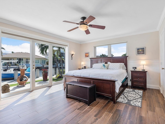 bedroom with ornamental molding, hardwood / wood-style floors, access to exterior, and ceiling fan