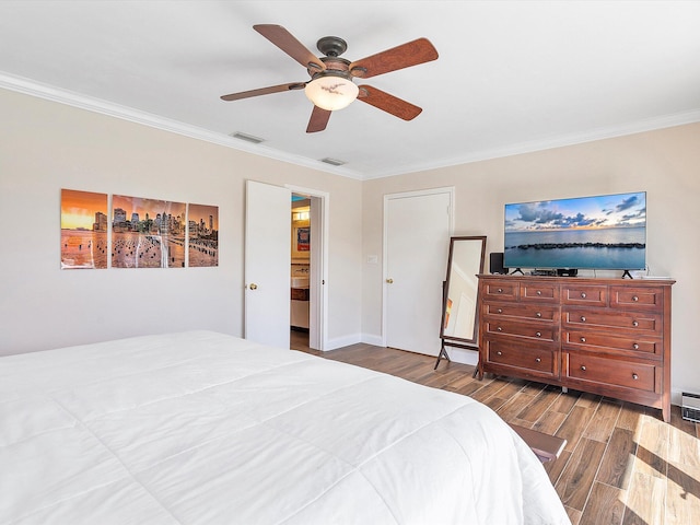 bedroom with hardwood / wood-style floors, crown molding, and ceiling fan