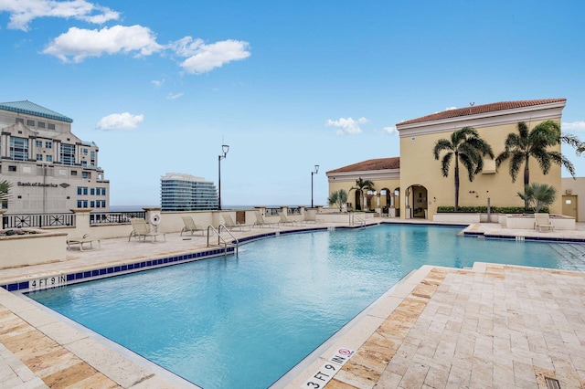 view of swimming pool featuring a patio