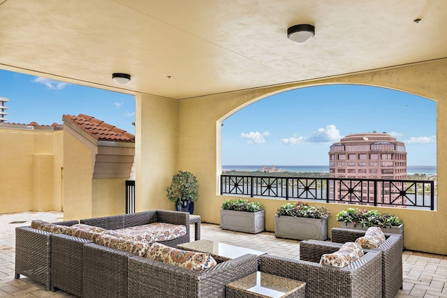 view of patio / terrace featuring outdoor lounge area and a water view